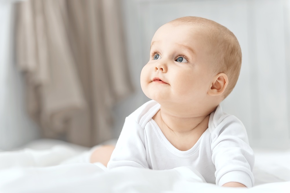 Infant in white clothes